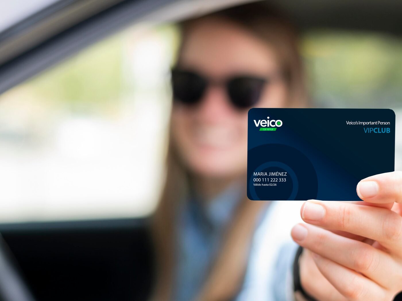Customer showing her Veico VIP Club card